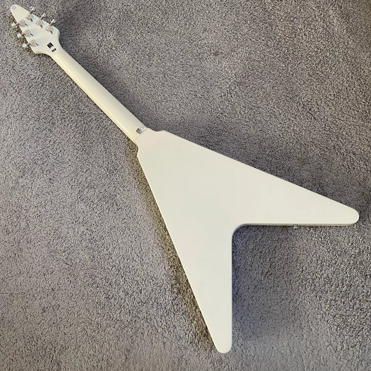 Flying V electric guitar with swallowtail design, 22 frets, Italian Okoume body, uniquely shaped stand, manufactured in Italy.