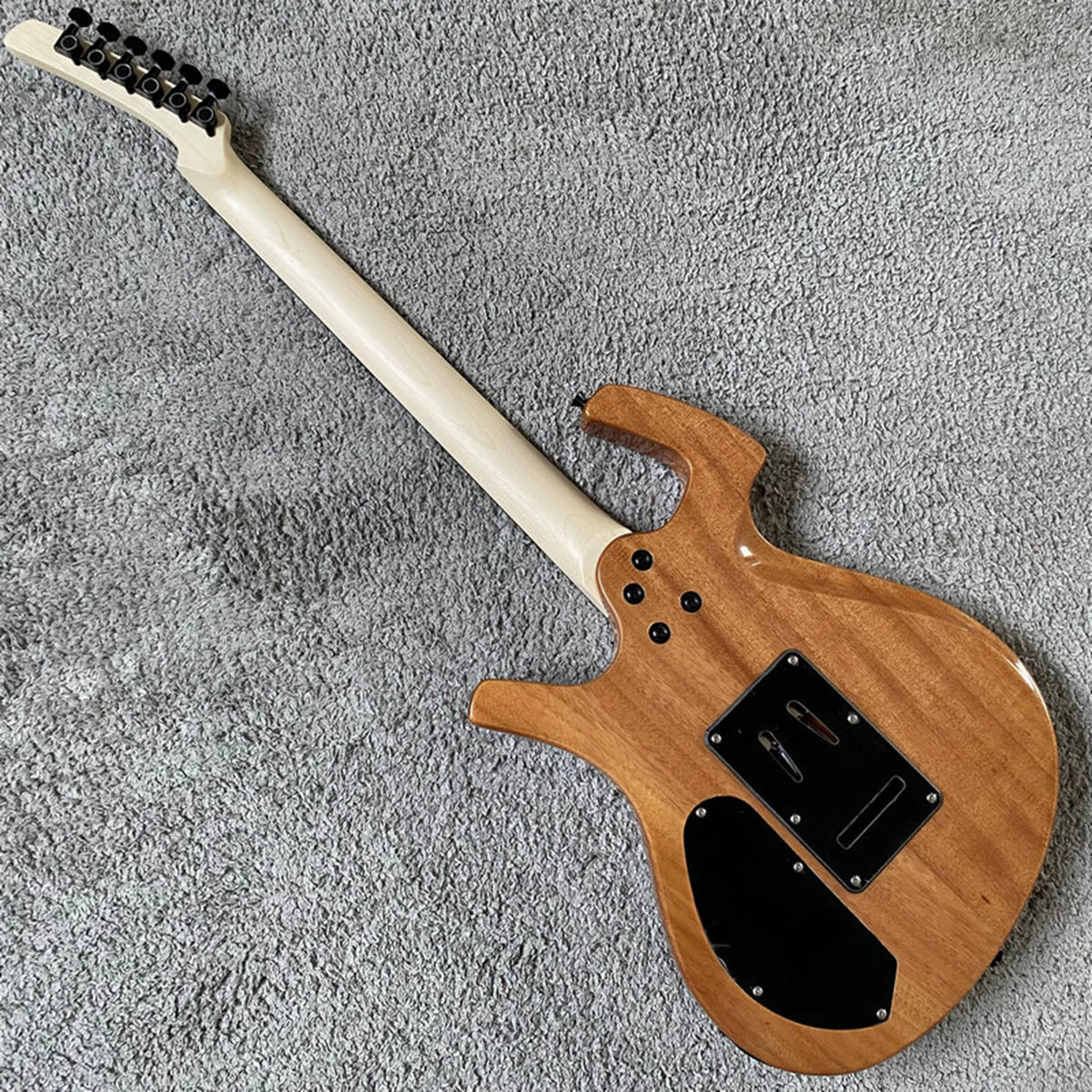 Solid mahogany body, 24 frets, rosewood double-tremolo electric guitar, Parker style, brand-name, with polished label, for export.