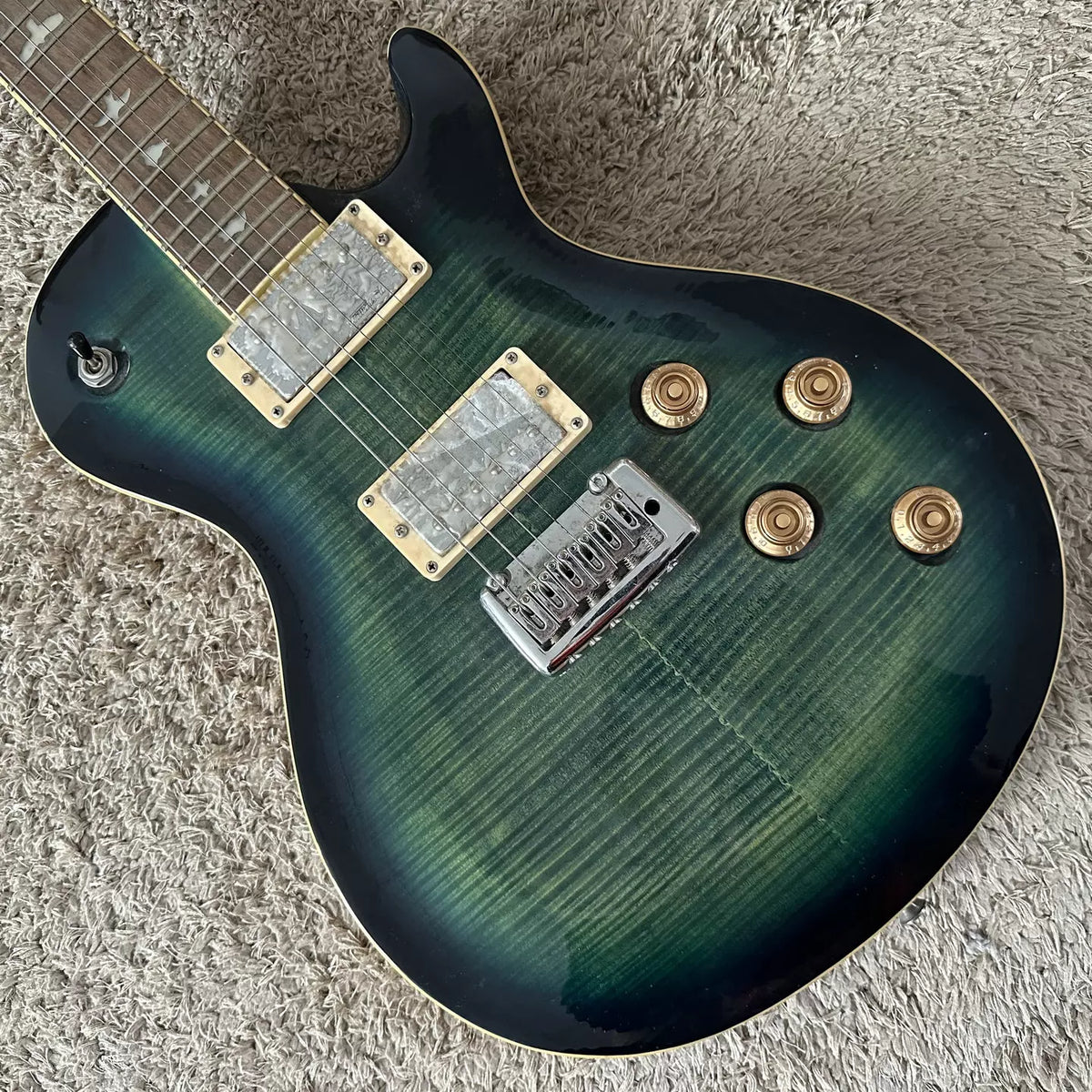 Mclonence electric guitar, maple tiger stripe, small double-tremolo, Wilkinson pickups (in stock).