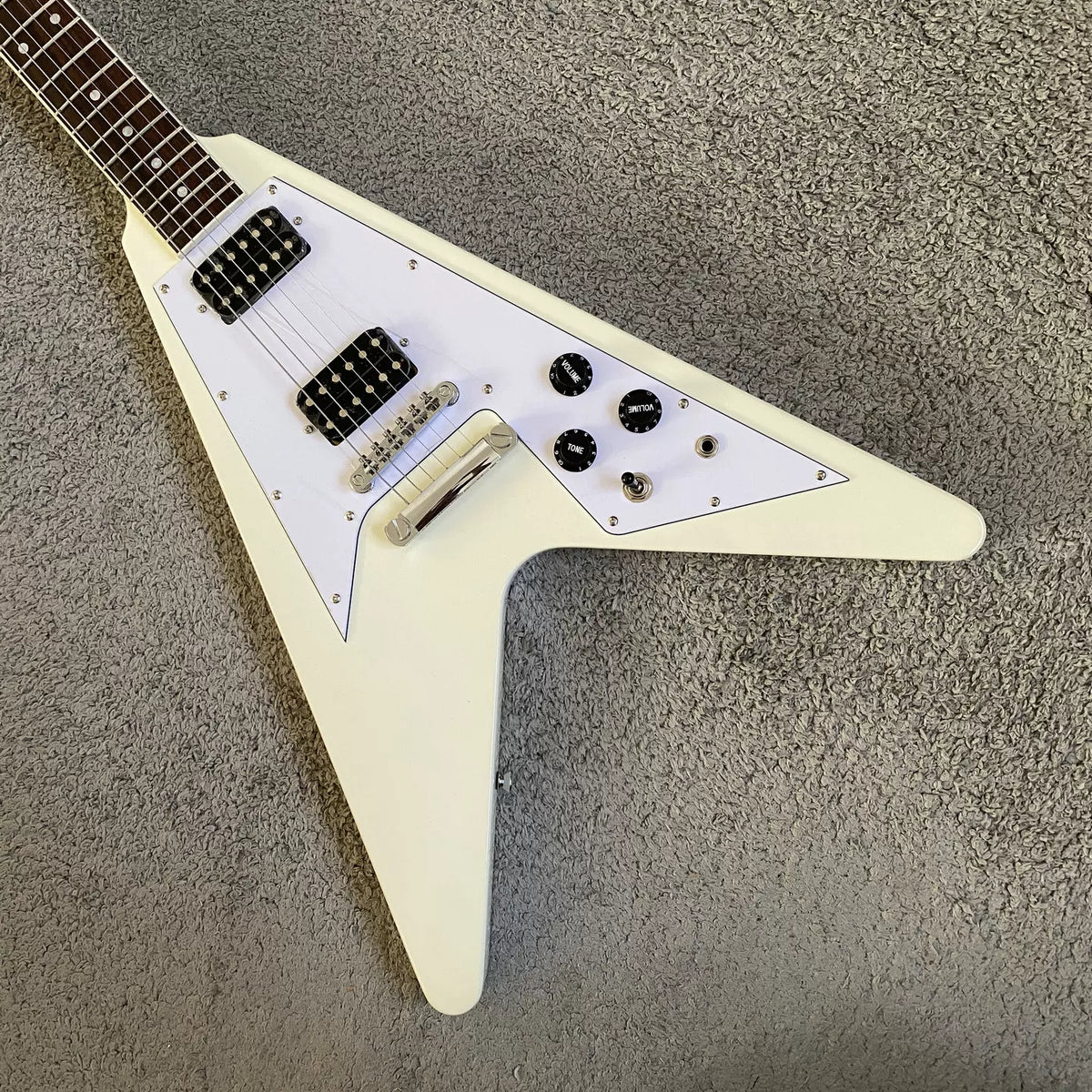 Flying V electric guitar with swallowtail design, 22 frets, Italian Okoume body, uniquely shaped stand, manufactured in Italy.