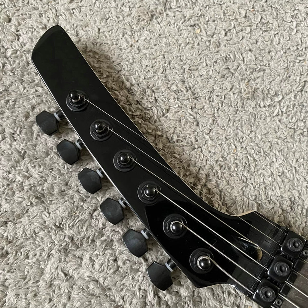 Solid mahogany body, 24 frets, rosewood double-tremolo electric guitar, Parker style, brand-name, with polished label, for export.