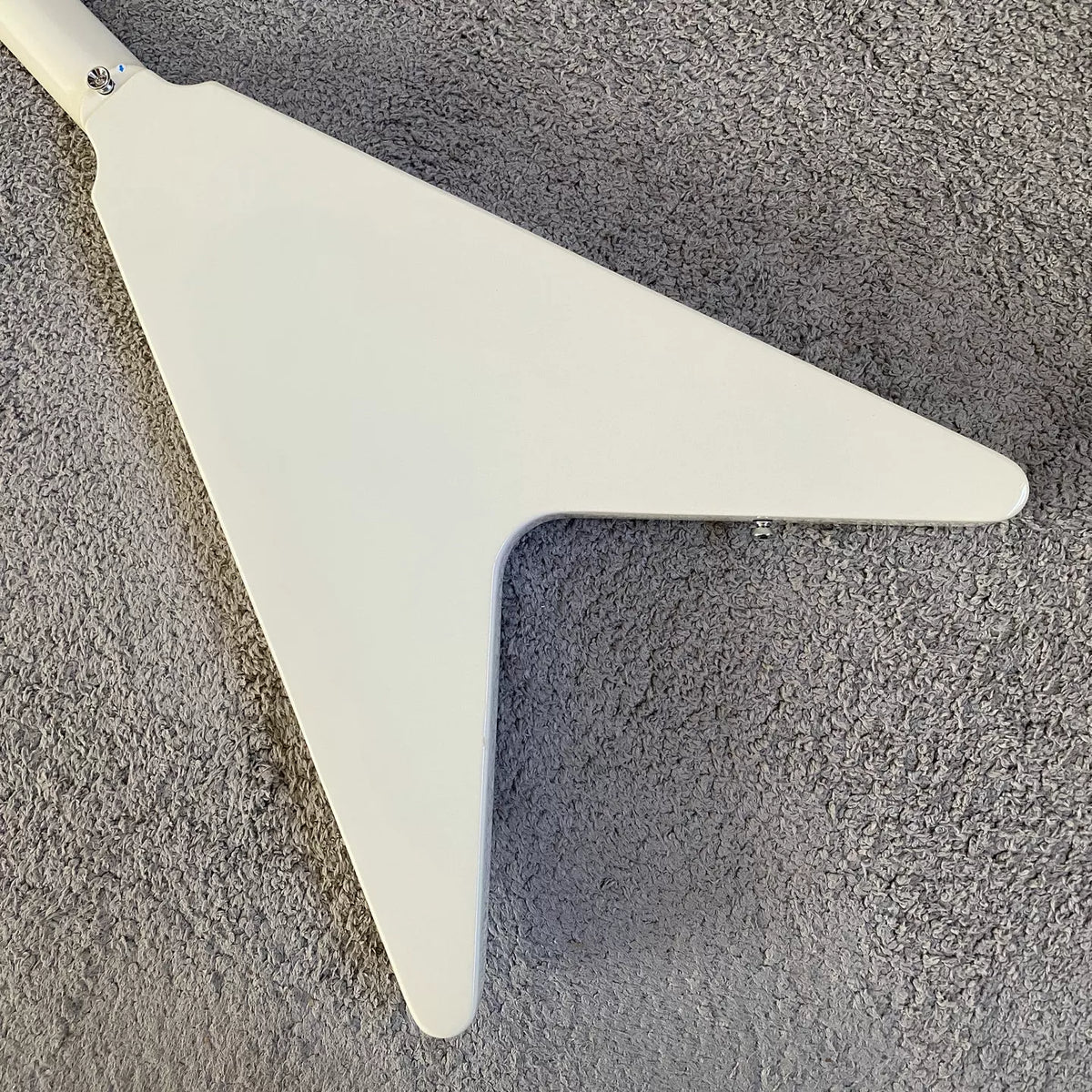 Flying V electric guitar with swallowtail design, 22 frets, Italian Okoume body, uniquely shaped stand, manufactured in Italy.