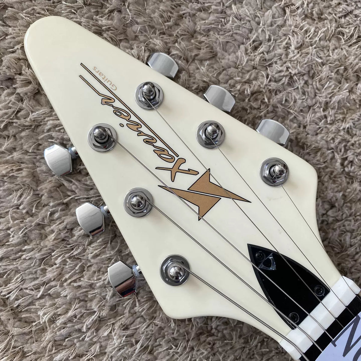 Xavier Flying V-shaped swallowtail off-white fork rock guitar
